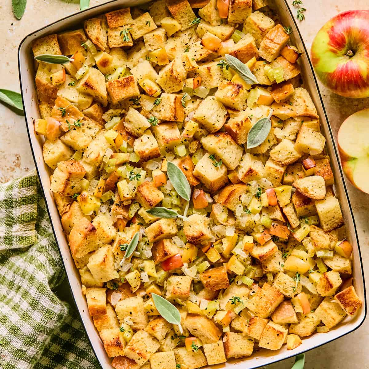 Pan with apple stuffing topped with herbs.