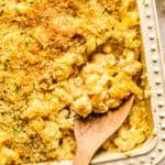 Macaroni and cheese in pan baked with breadcrumbs and chopped parsley on top.