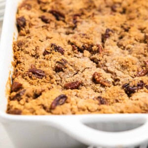 Casserole dish with baked pumpkin French Toast casserole.