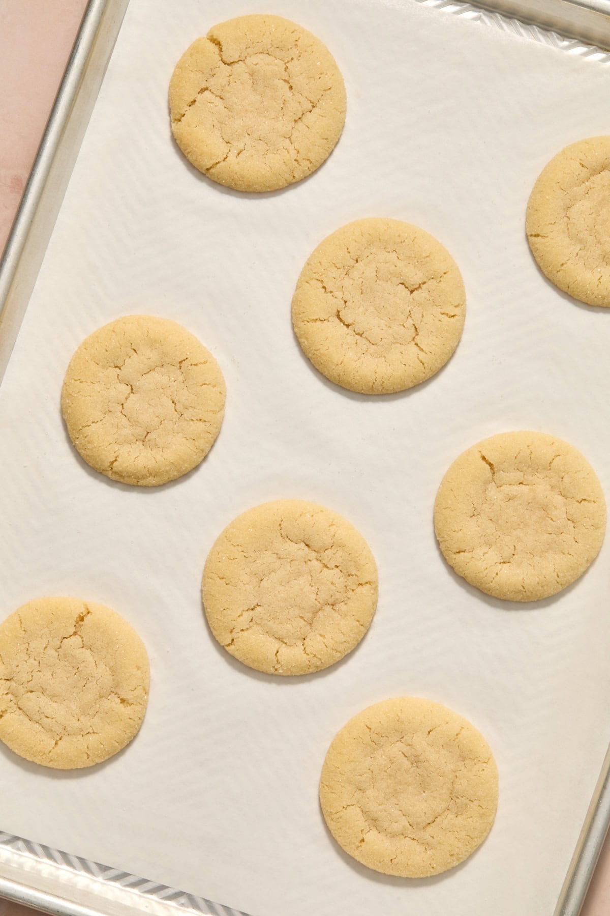 Baked eggless sugar cookies on pan.