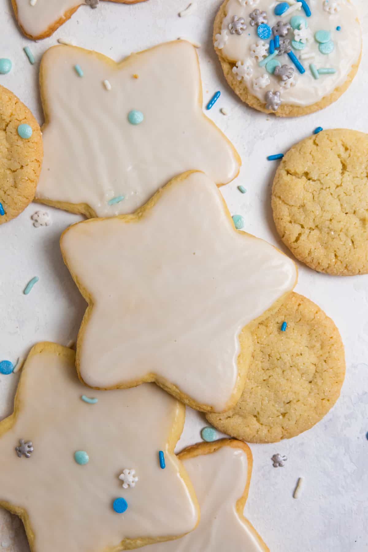 Overhead view of cutout star cookies with white icing.