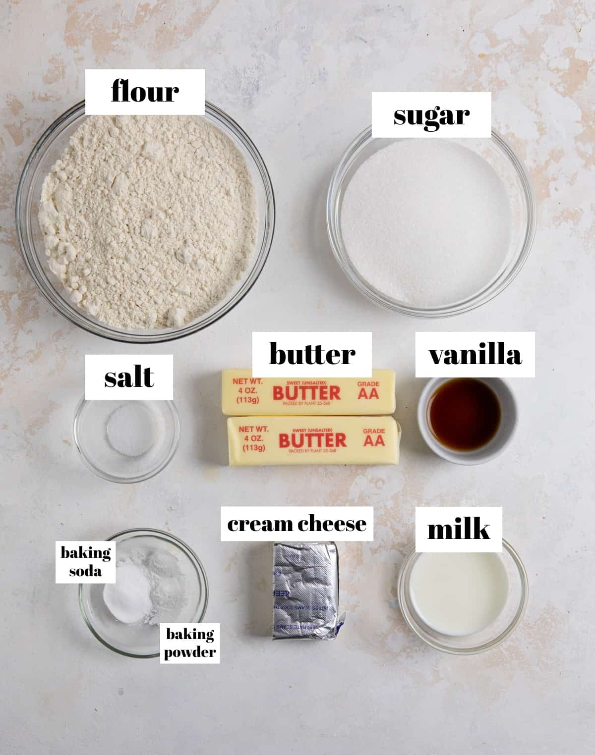 Flour, milk, cream cheese, baking soda and other ingredients to make cookie recipe.