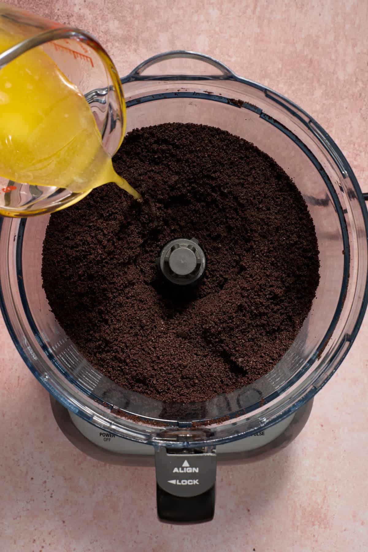 Melted butter poured into Oreo cookie crumbs.