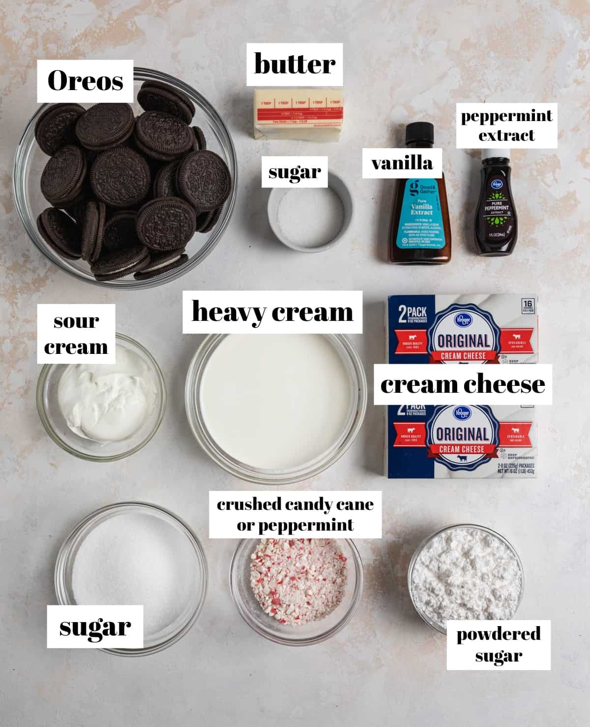 Oreos, crushed candy canes, cream cheese, powdered sugar and other ingredients to make peppermint cheesecake.