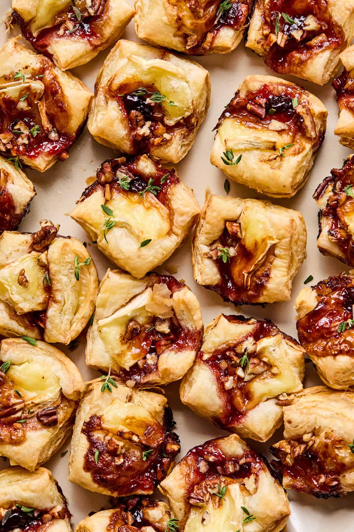 Overhead view of puff pastry brie bites on dish.