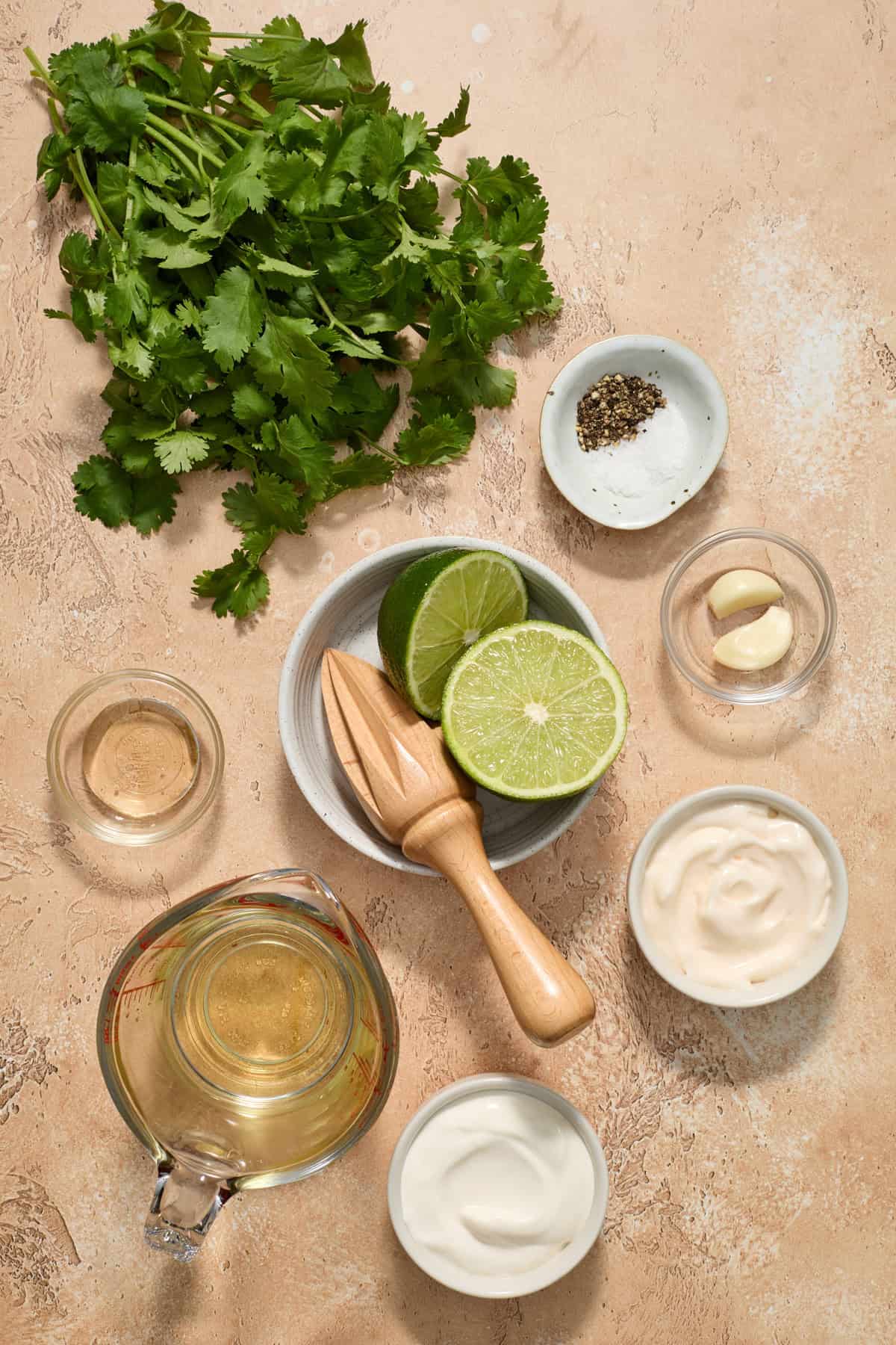 Cilantro, halved lime, sea salt, mayo and other dressing ingredients.