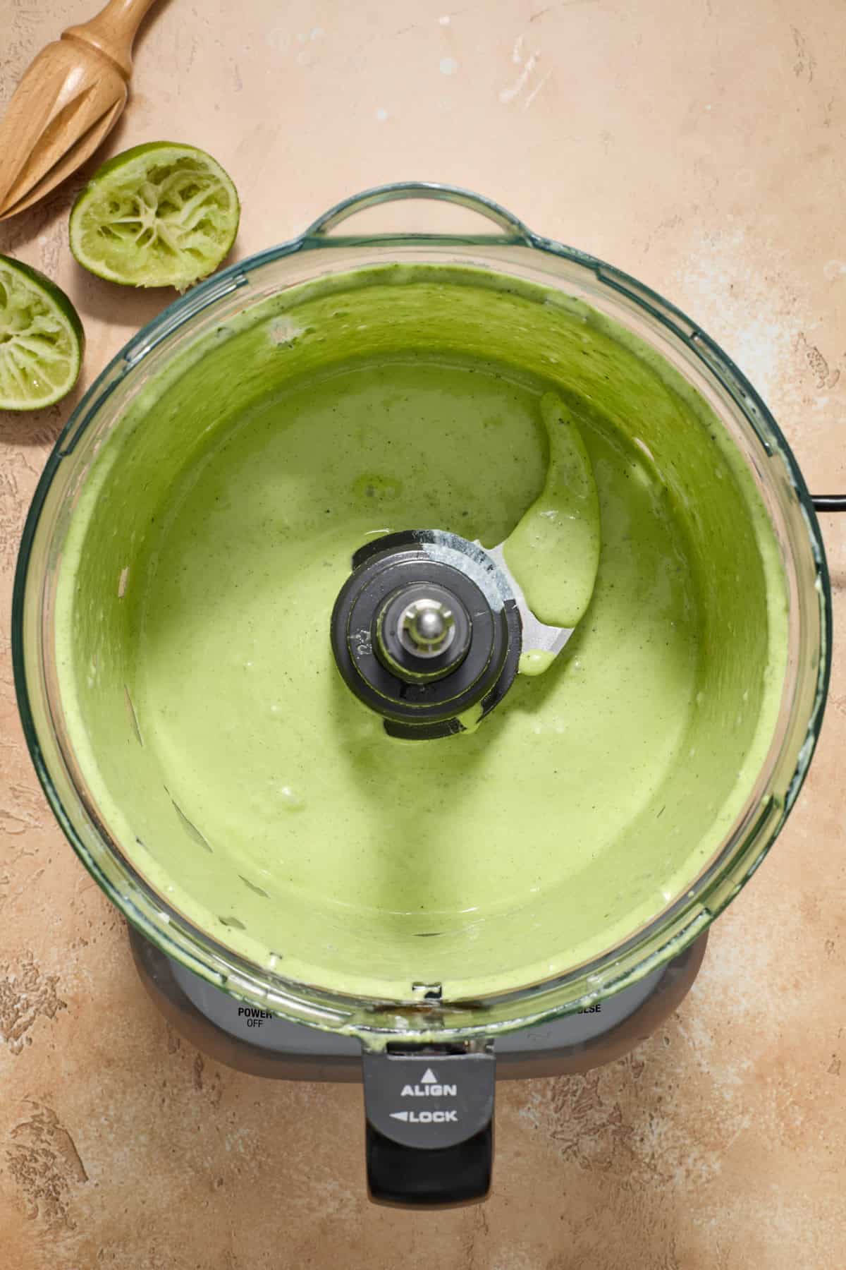 Creamy cilantro lime dressing in food processor.