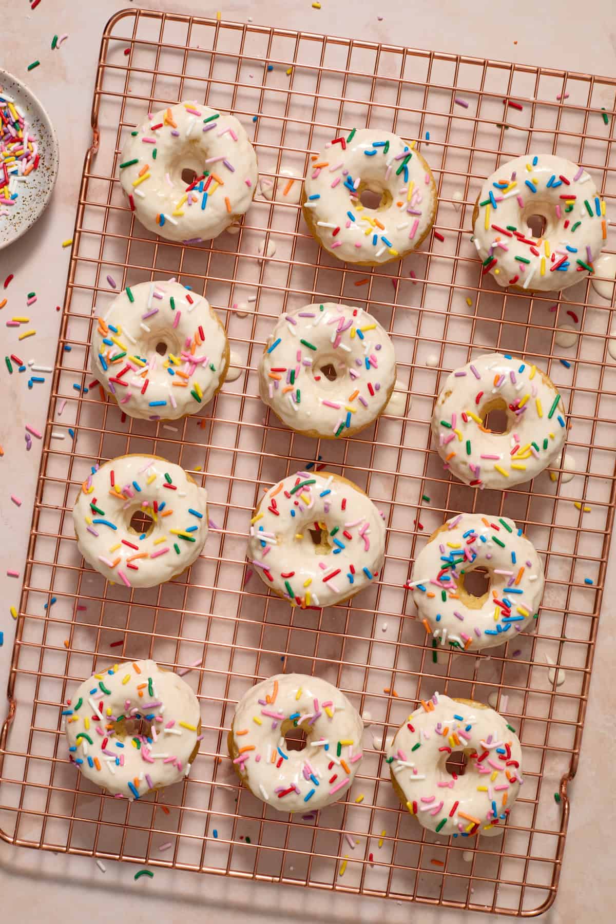Maple vanilla glazed donuts on cooling rack.