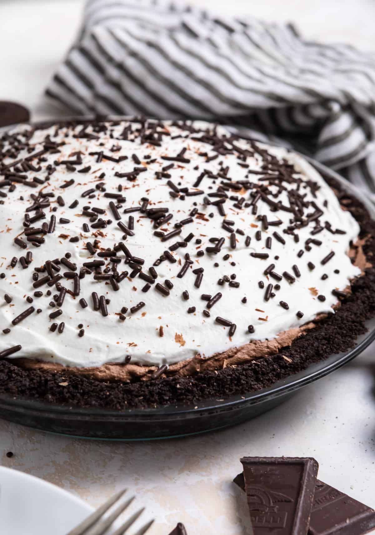 No bake chocolate pie with chocolate sprinkles on top.