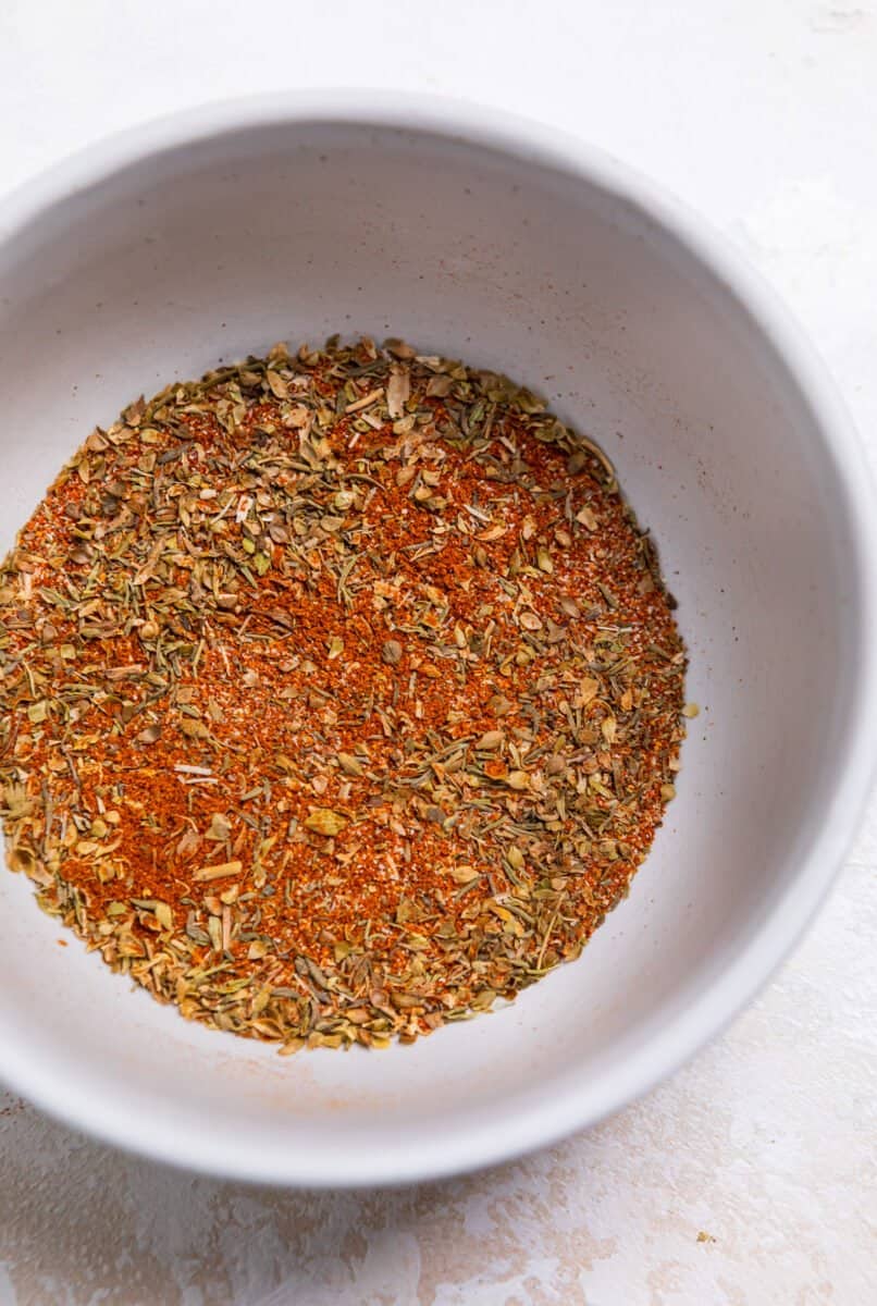 Cajun spices in dish mixed together.