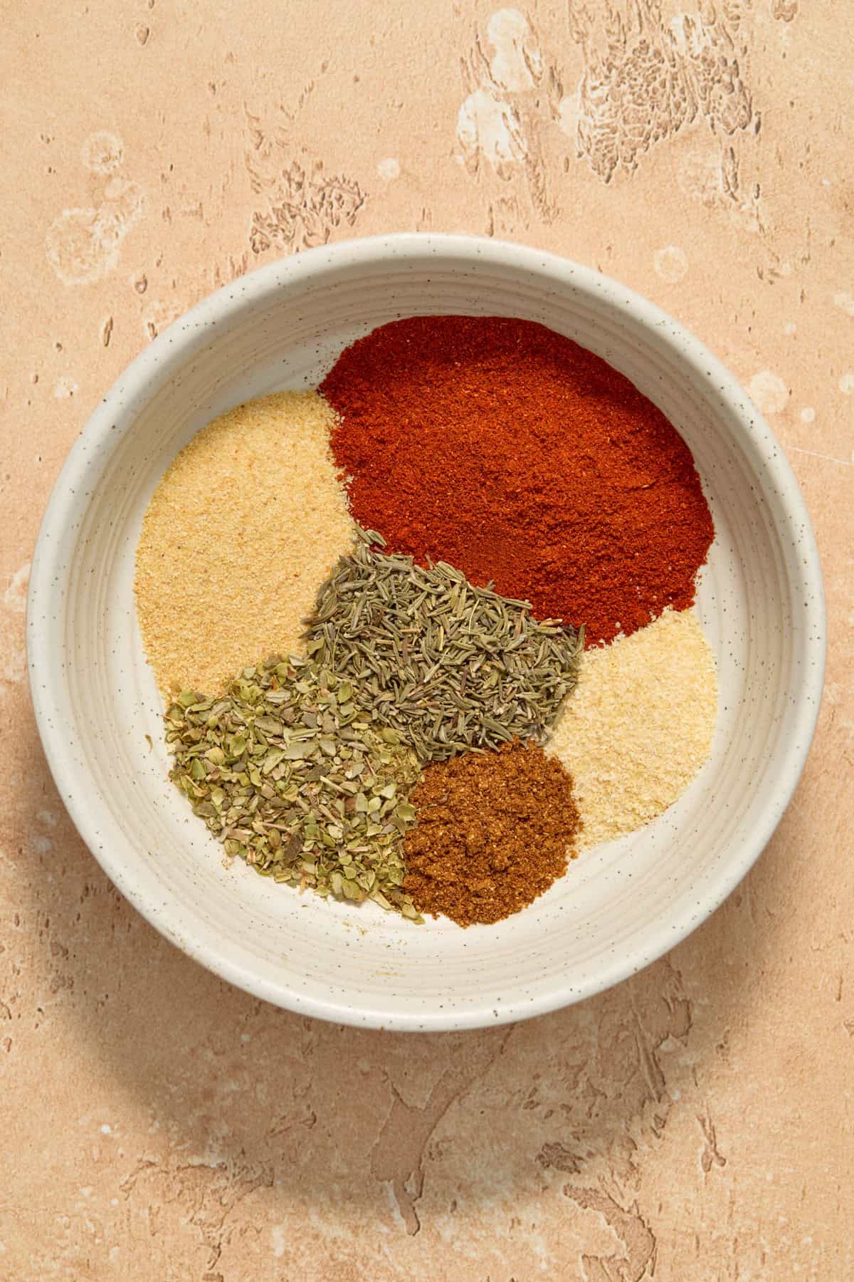 Smoked paprika, garlic powder and other cajun seasonings in bowl.