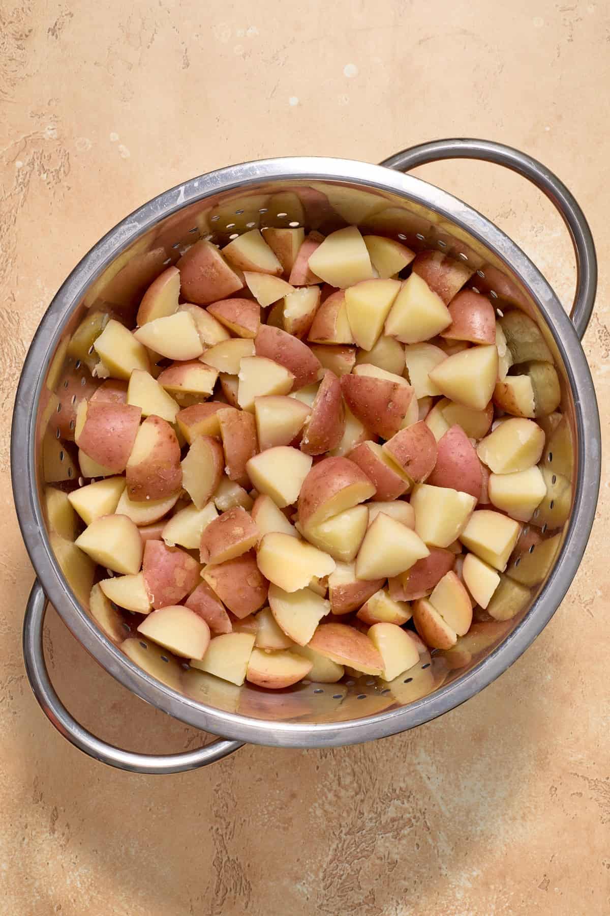 Potatoes cooked in pot.