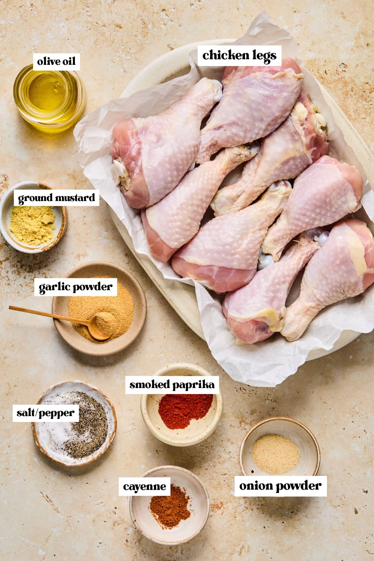 Labeled ingredients on surface for grilled chicken drumsticks.
