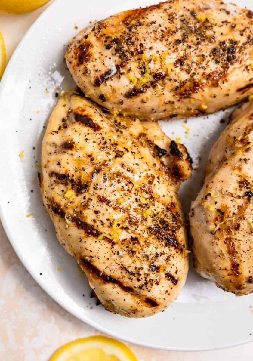 Plate with freshly grilled lemon pepper chicken.