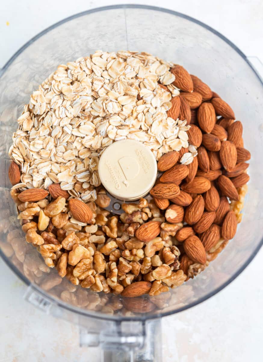Almonds, walnuts and rolled oats in food processor.