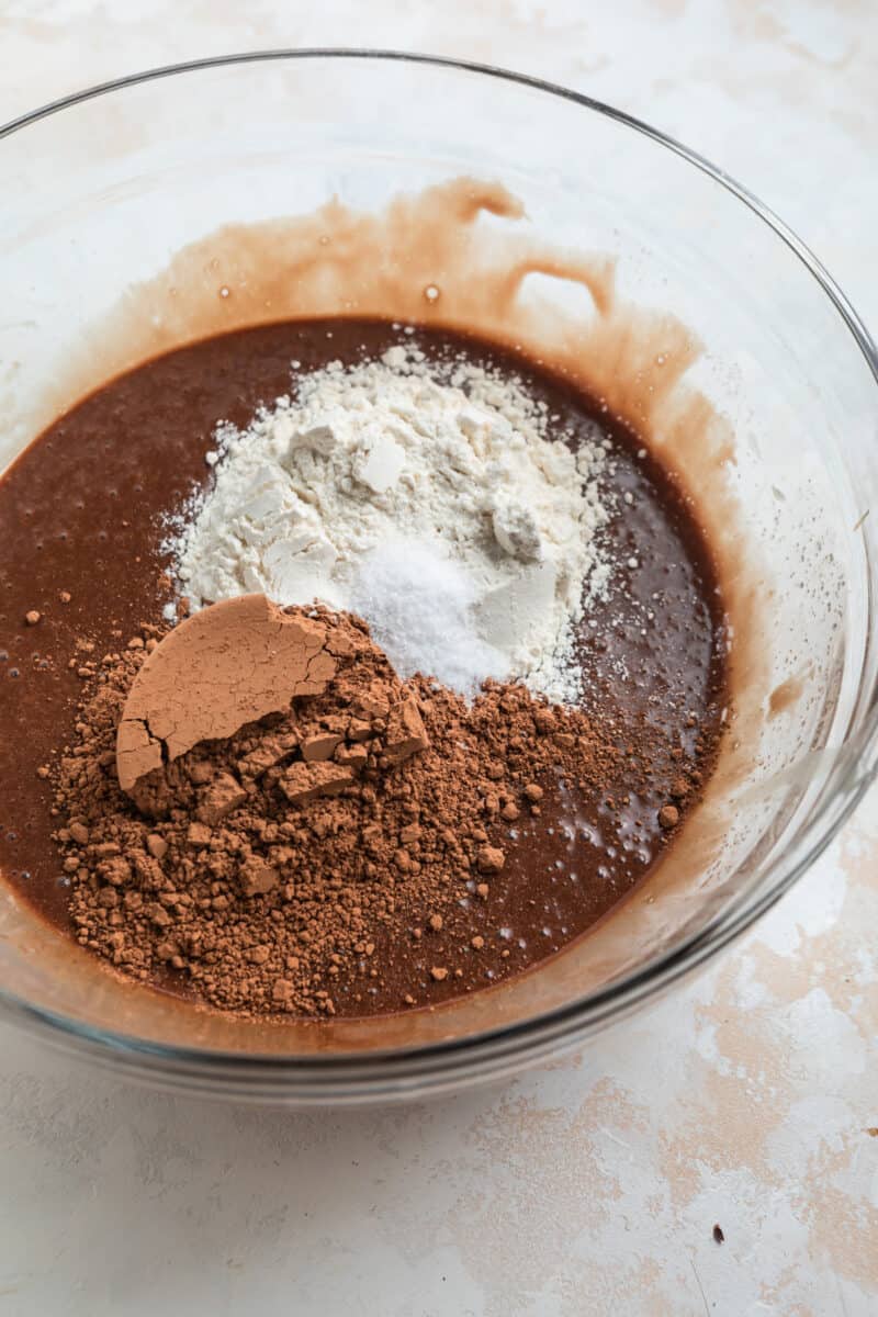 Flour, cocoa powder and salt added to mixing bowl.