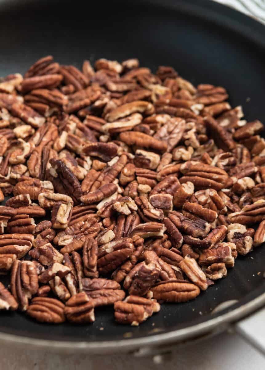 Toasted pecans in skillet.