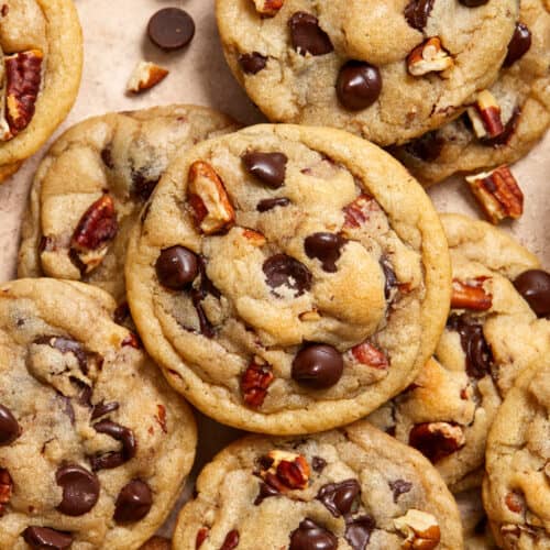 Chocolate chip pecan cookies arranged on surface.