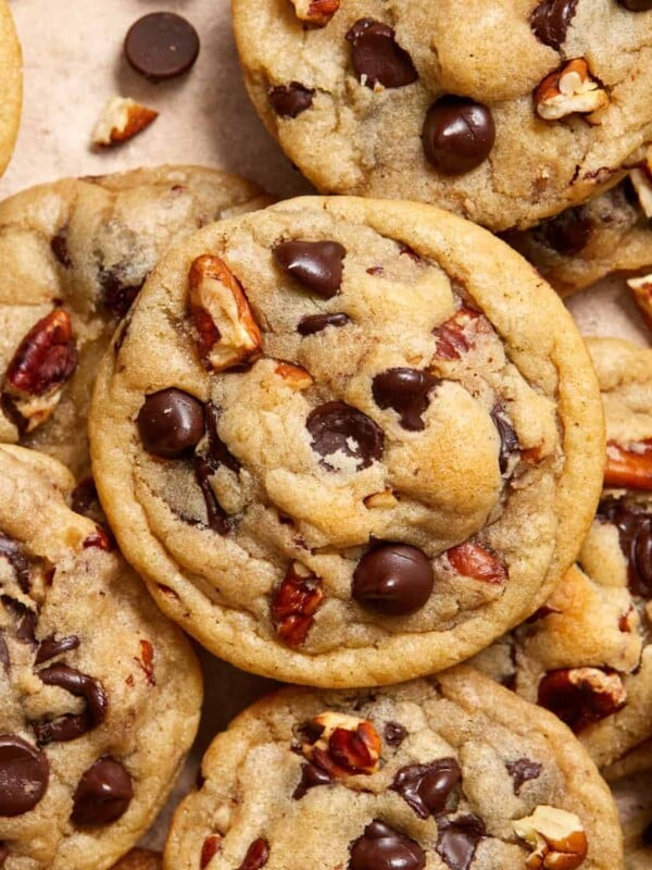 Chocolate chip pecan cookies arranged on surface.
