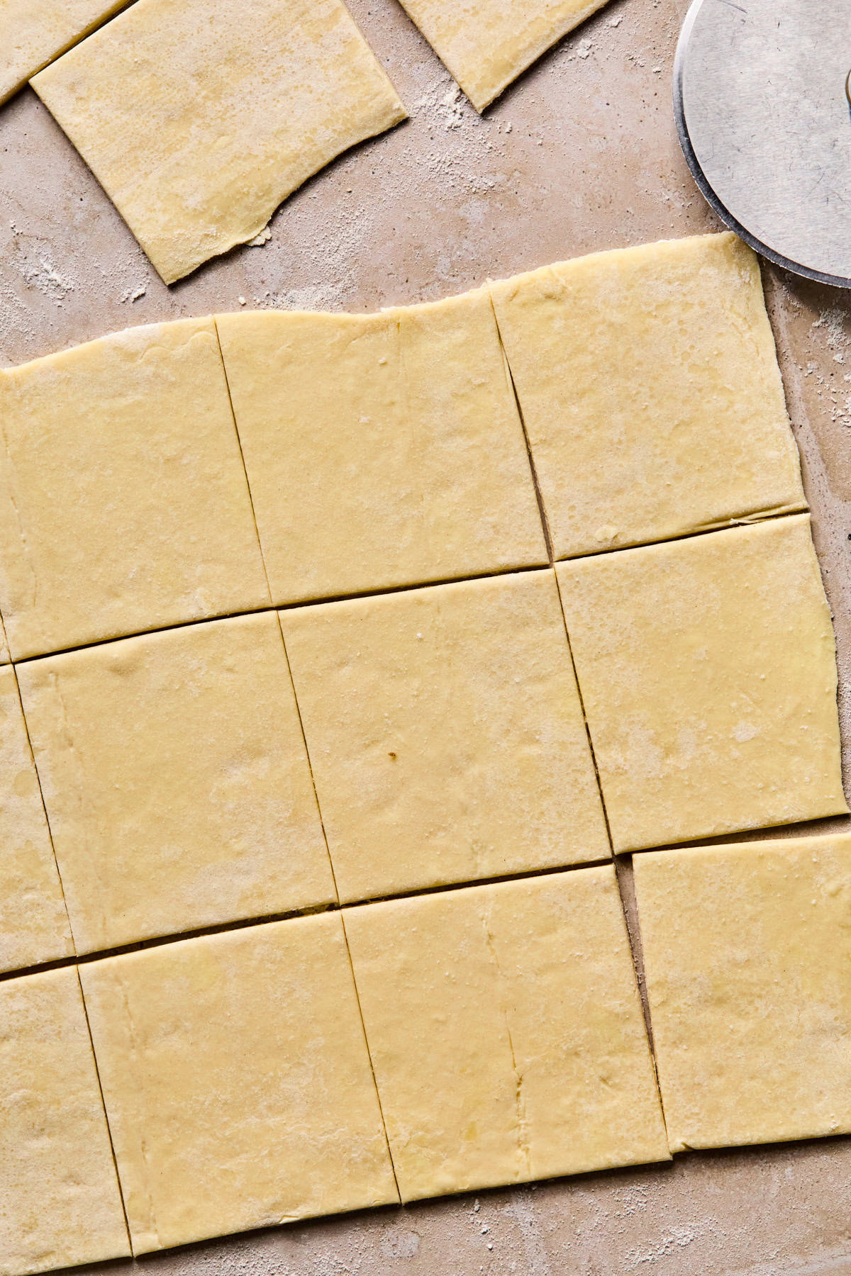 Puff pastry rolled out and cut into squares.