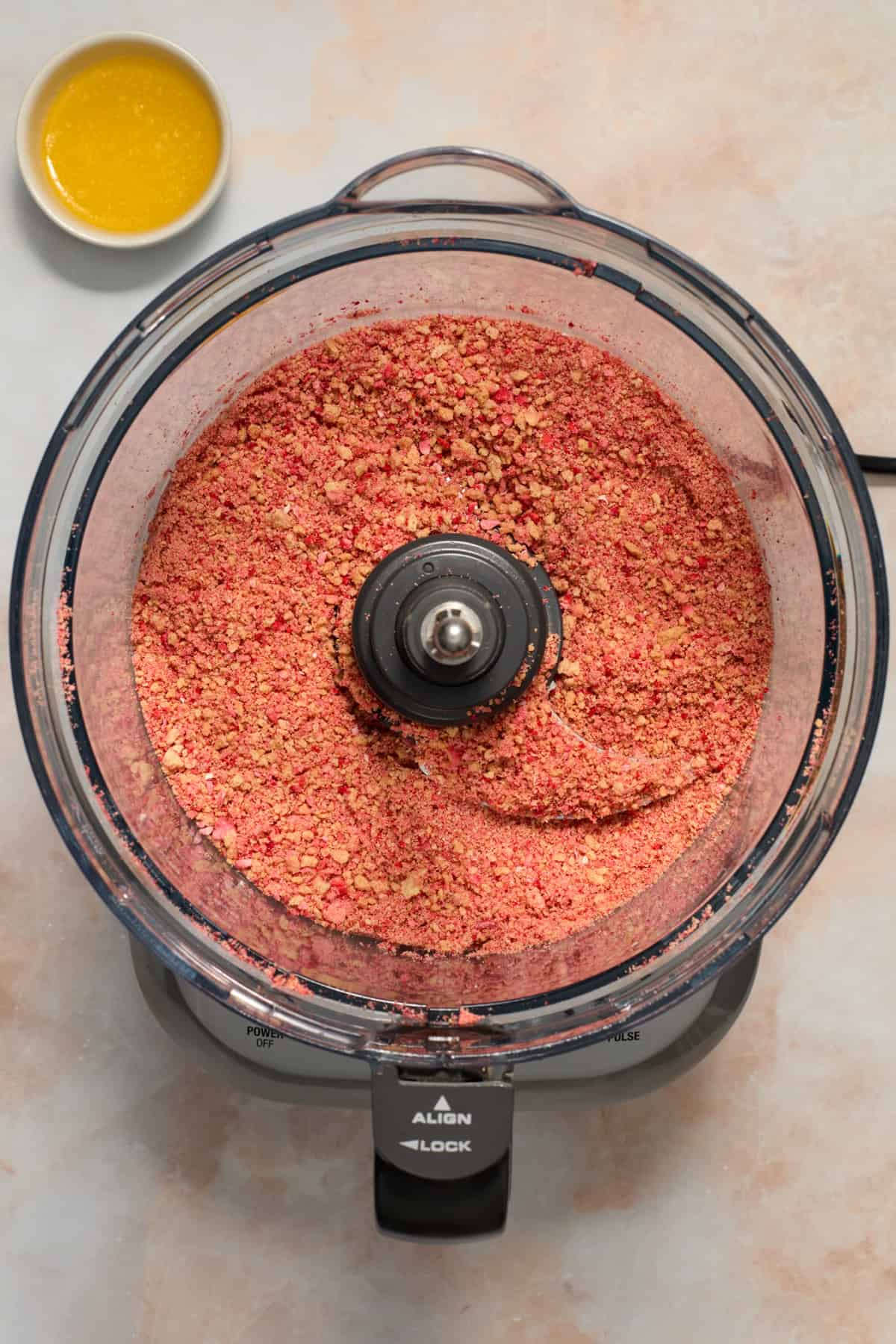 Crumbled Golden Oreos and freeze-dried strawberries in food processor.