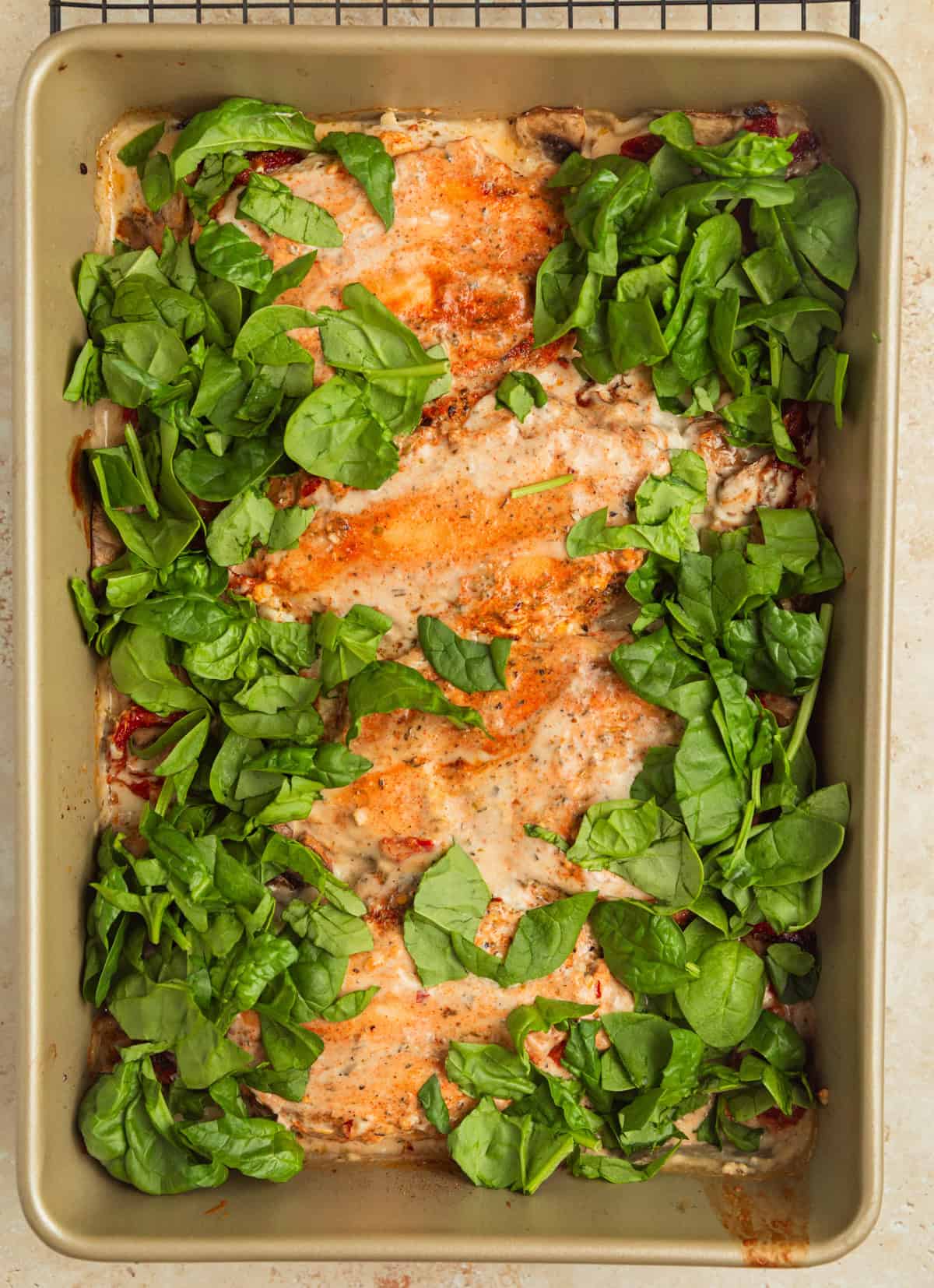 Spinach chopped and added to pan with creamy chicken.