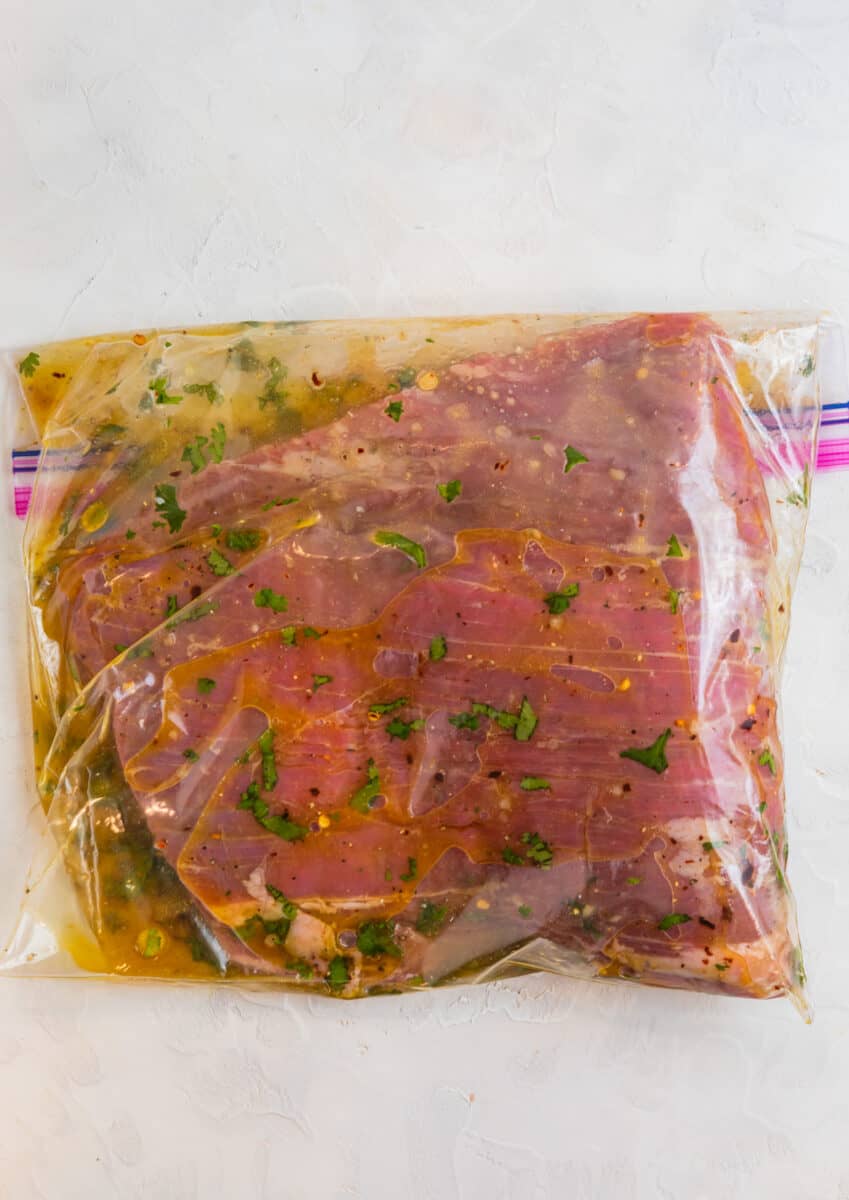 Steak in plastic bag with marinade.