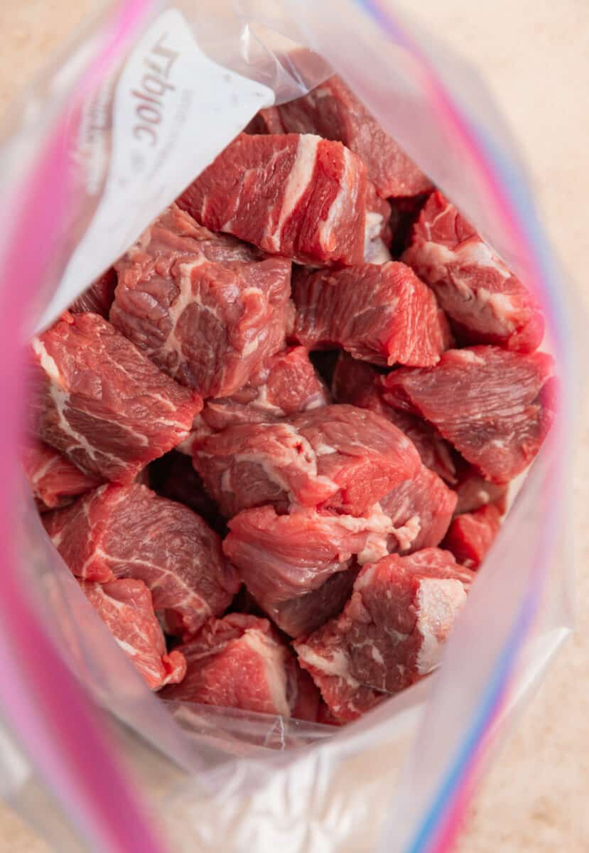 Cubed beef in plastic bag.