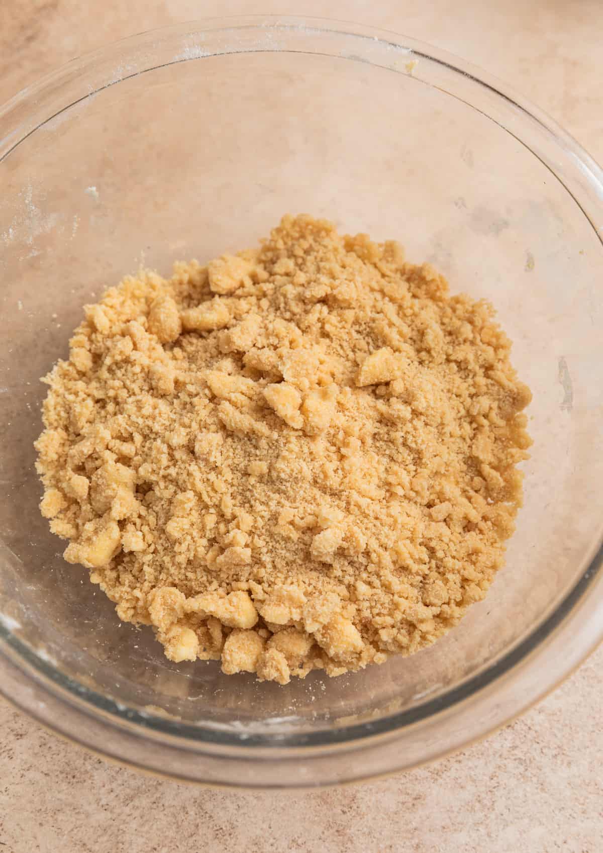 Crumbed streusel mixture in glass bowl.