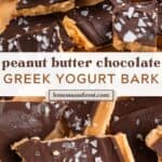Peanut butter and chocolate yogurt bark on parchment topped with sea salt flakes.