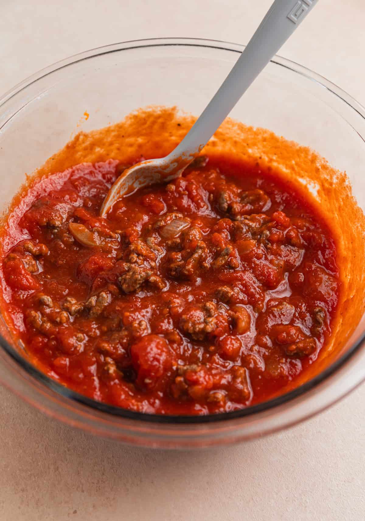 Ground beef stirred into marinara.