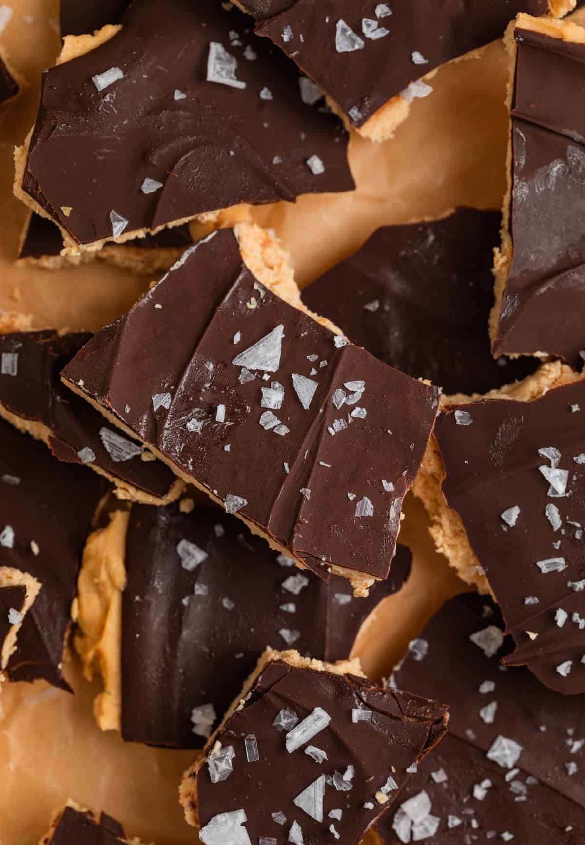 Greek yogurt bark broken into pieces with flaky sea salt on top.