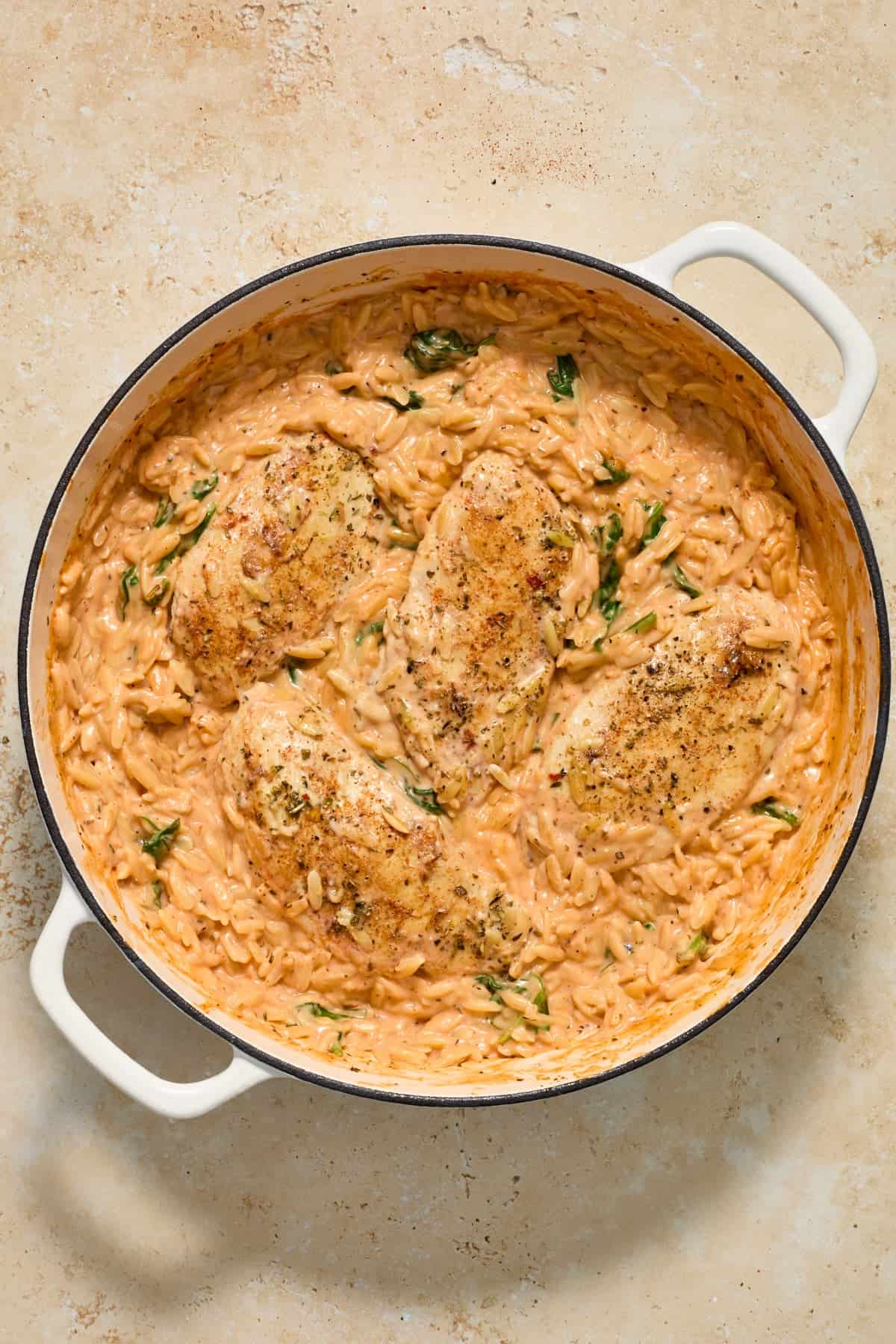 Chicken and orzo creamy skillet dinner in pan.
