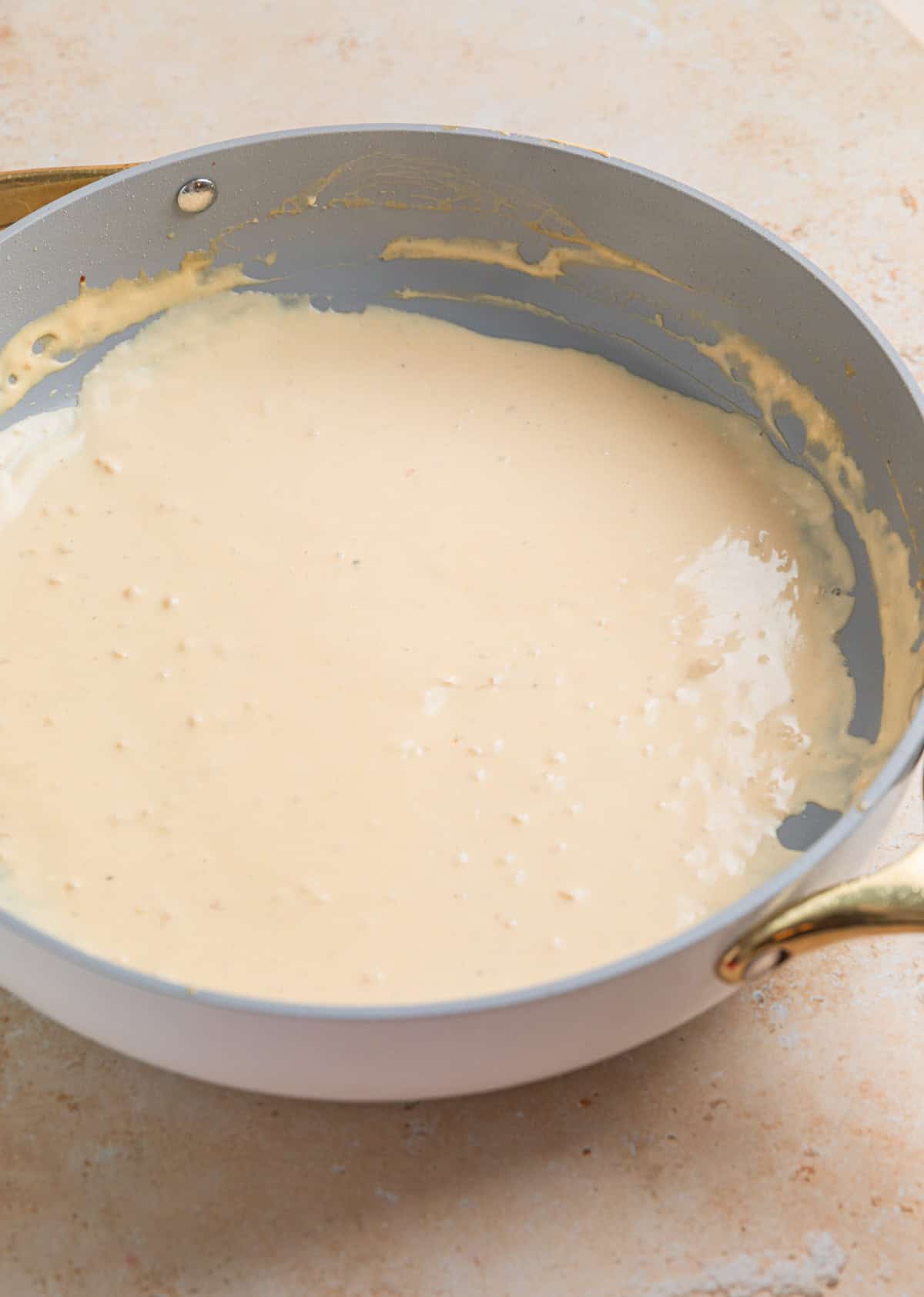 Cream cheese sauce in skillet.