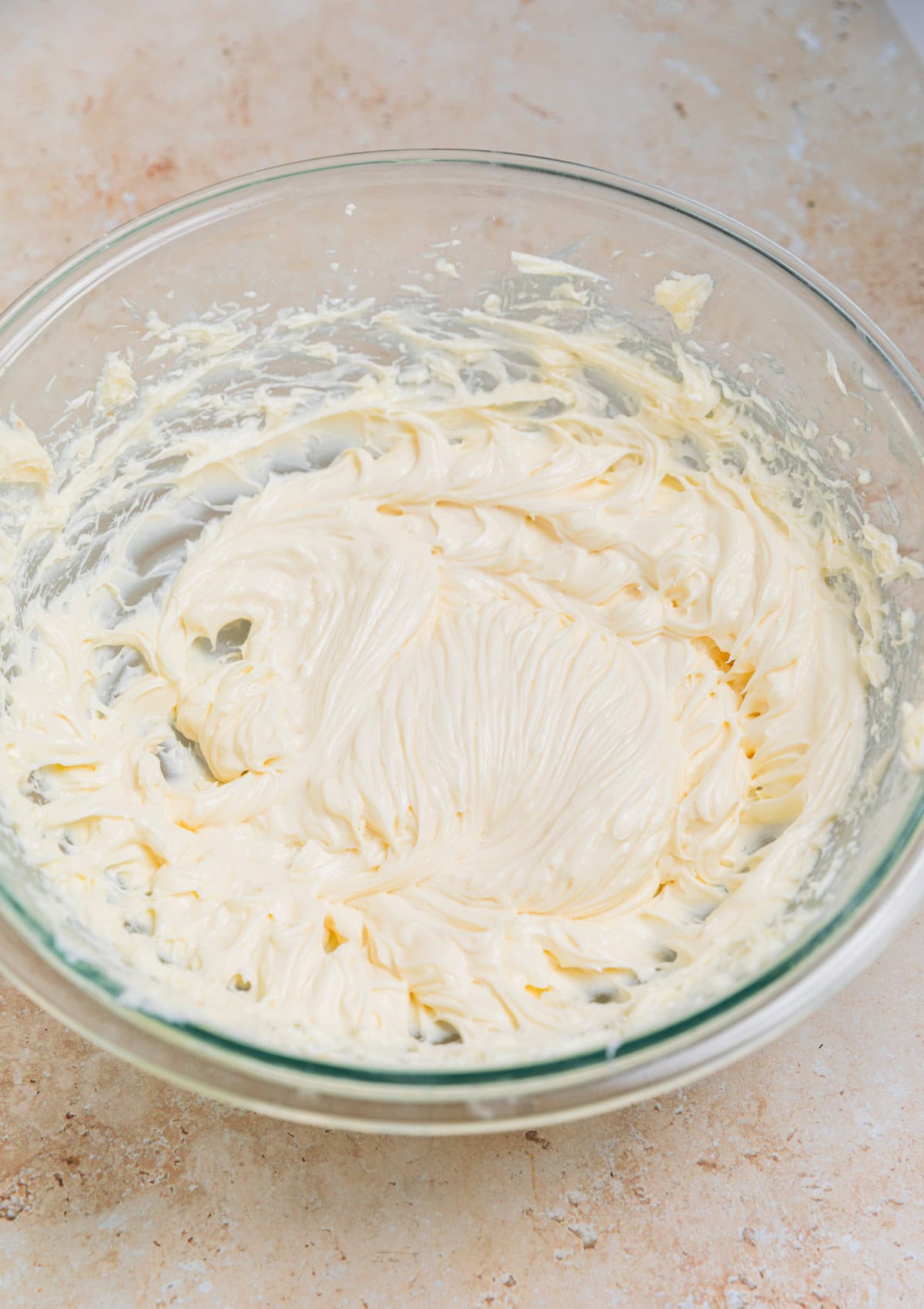 No bake cheesecake mixture in glass mixing bowl.