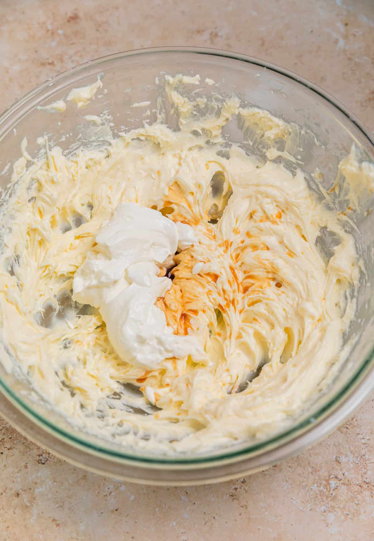 Cream cheese mixture with vanilla and sour cream added in.