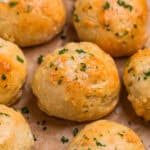 Greek yogurt yeast free dinner rolls topped with garlic butter and parsley.