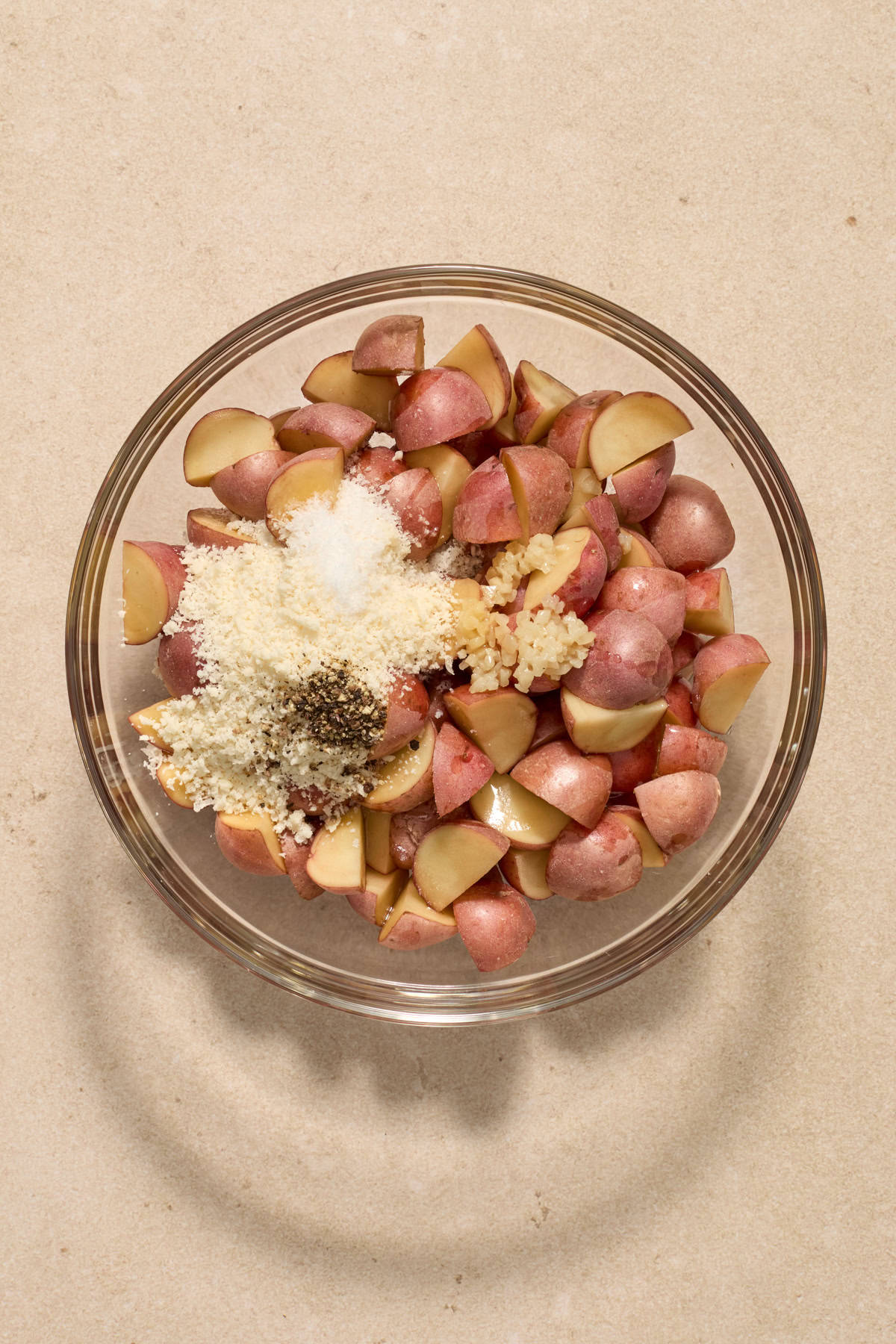 Quartered potatoes with parmesan, olive oil and seasoning.