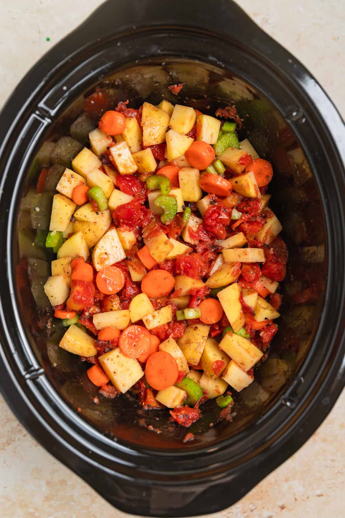 Mixed soup ingredients in slow cooker.