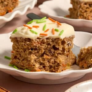 Slice of carrot cake made from a box mix on plate.