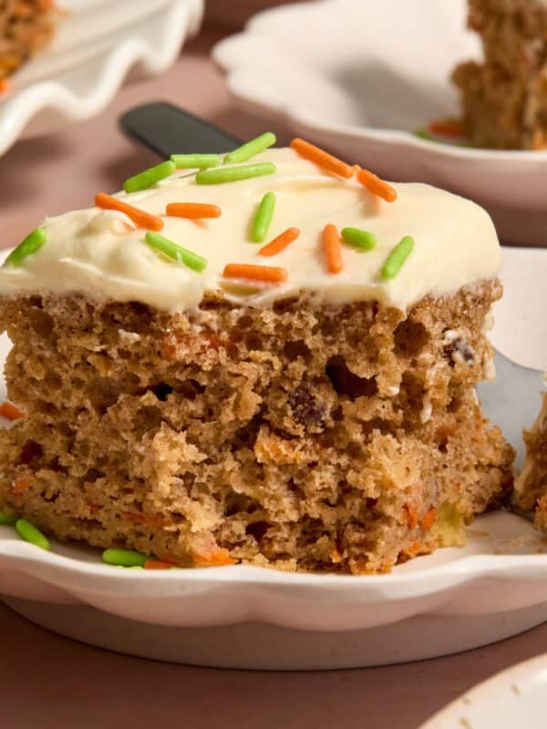 Slice of carrot cake made from a box mix on plate.