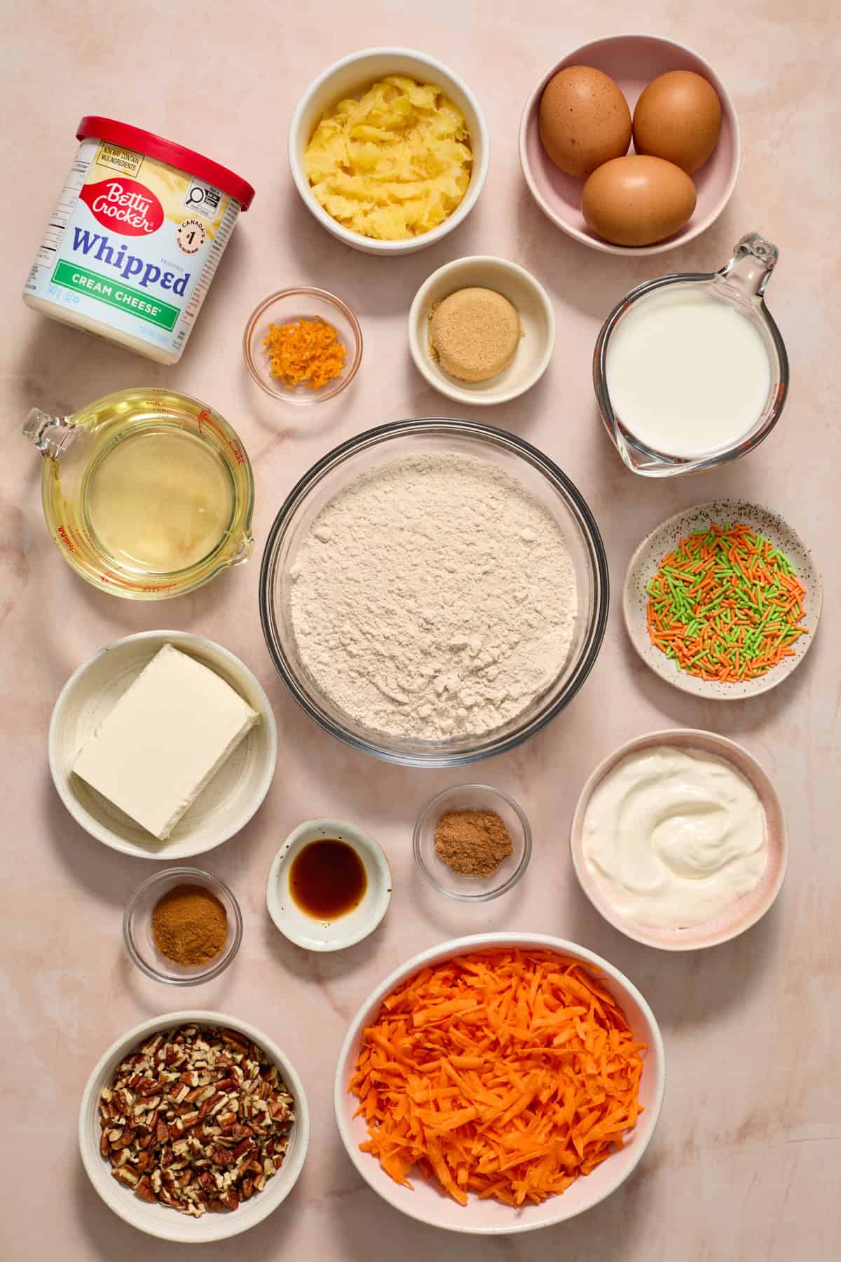 Boxed carrot cake mix ingredients on surface.