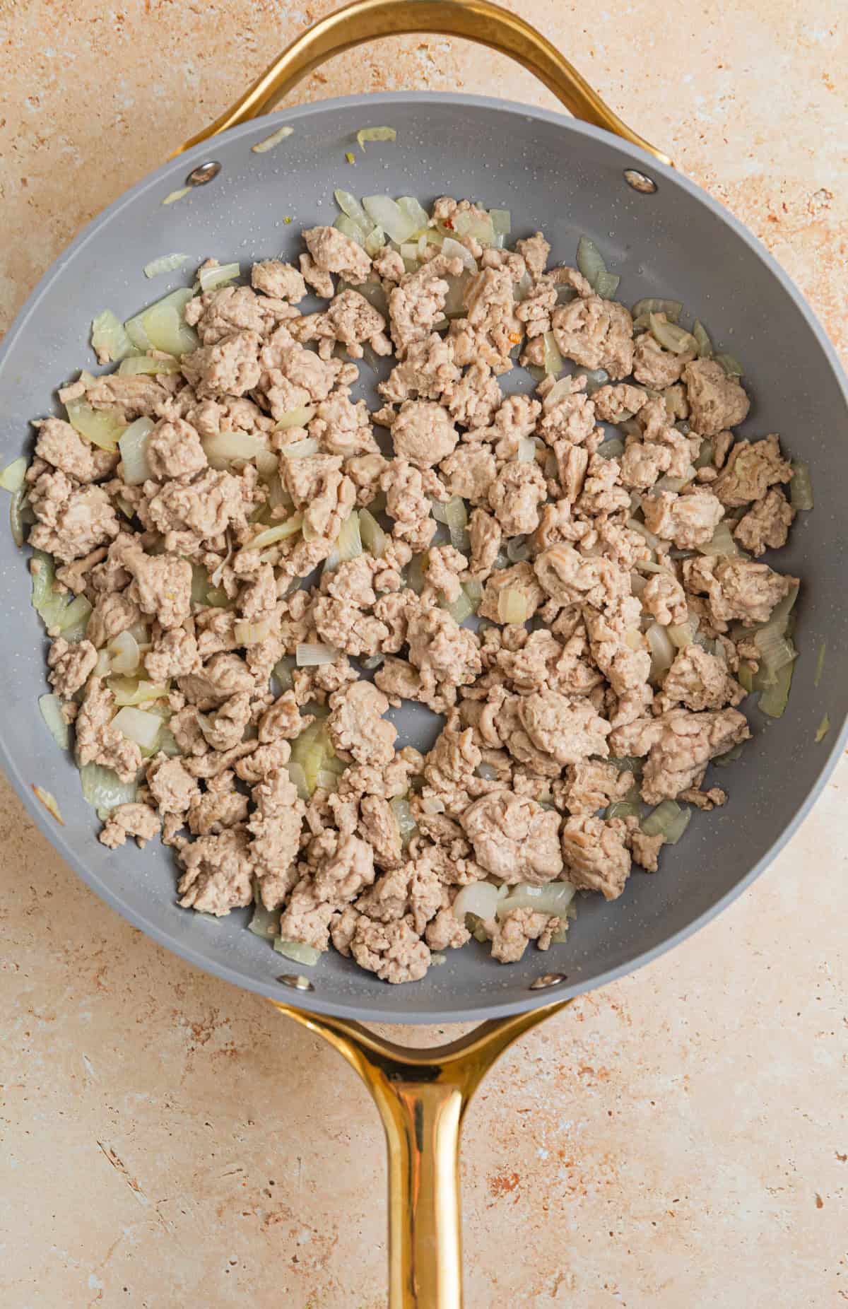 Ground turkey browned in skillet with onions and garlic.