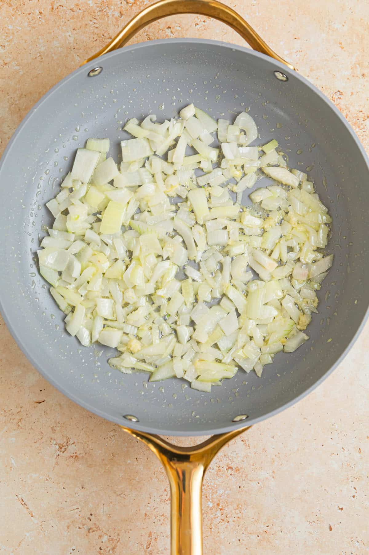 Sautéed onions in butter in skillet.