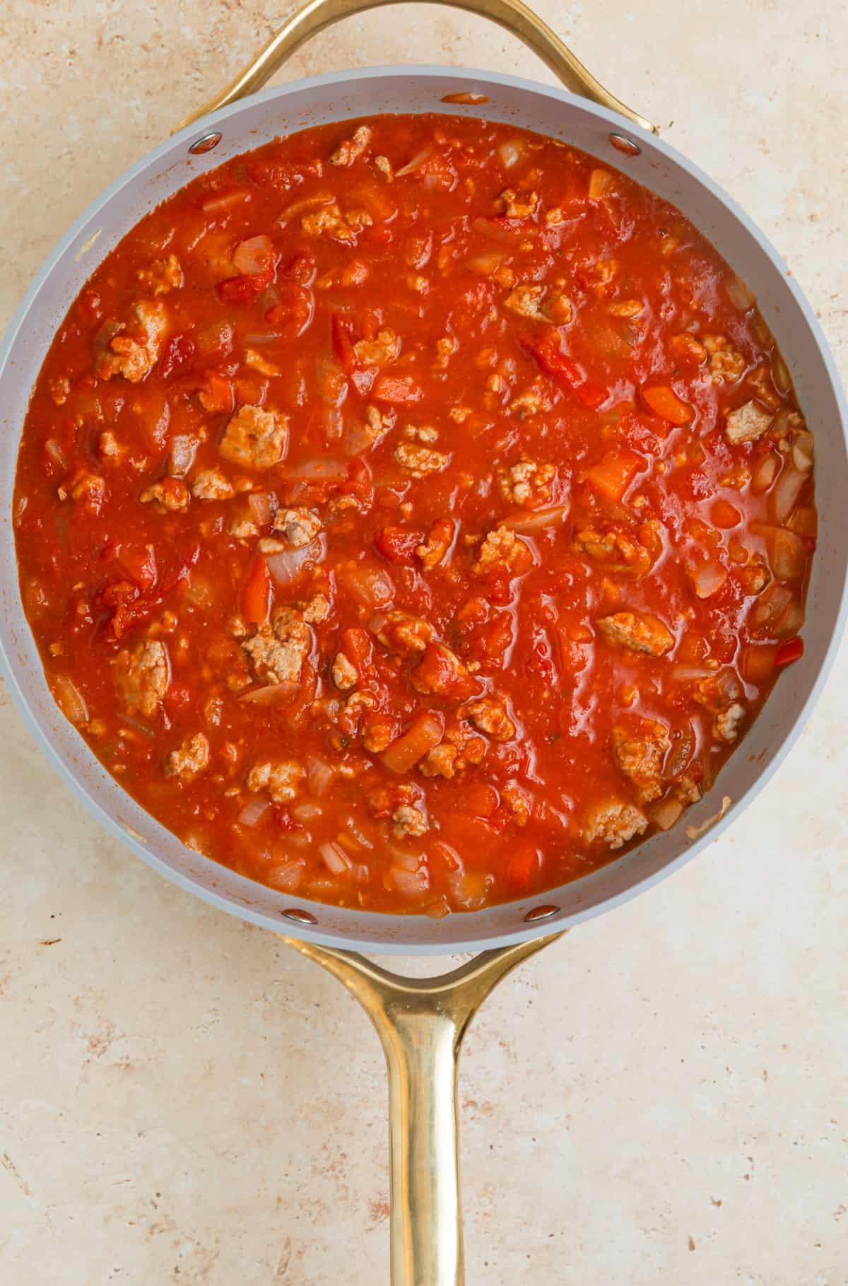 Marinara added to skillet with browned turkey and veggies.