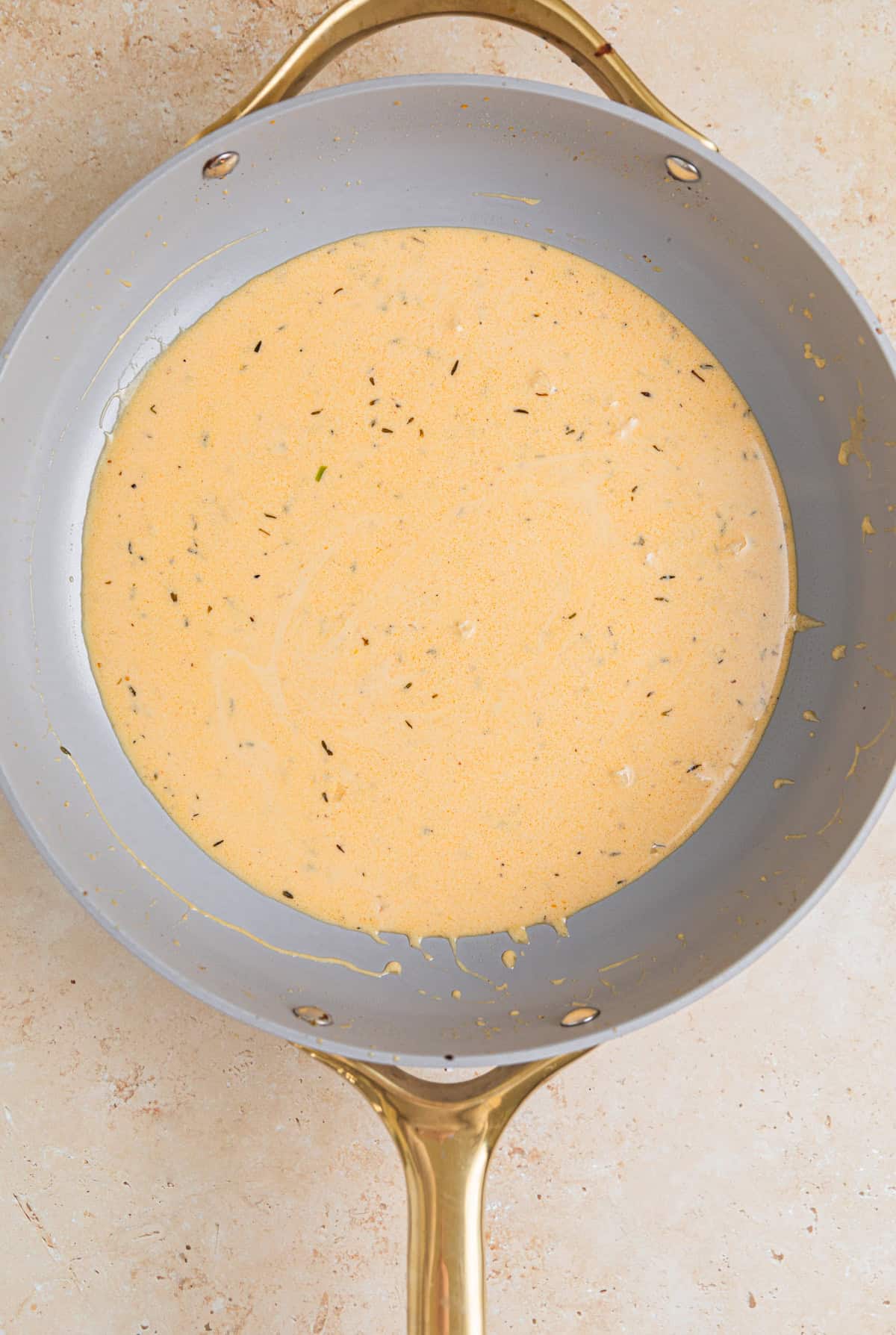 Creamy mustard sauce in skillet.