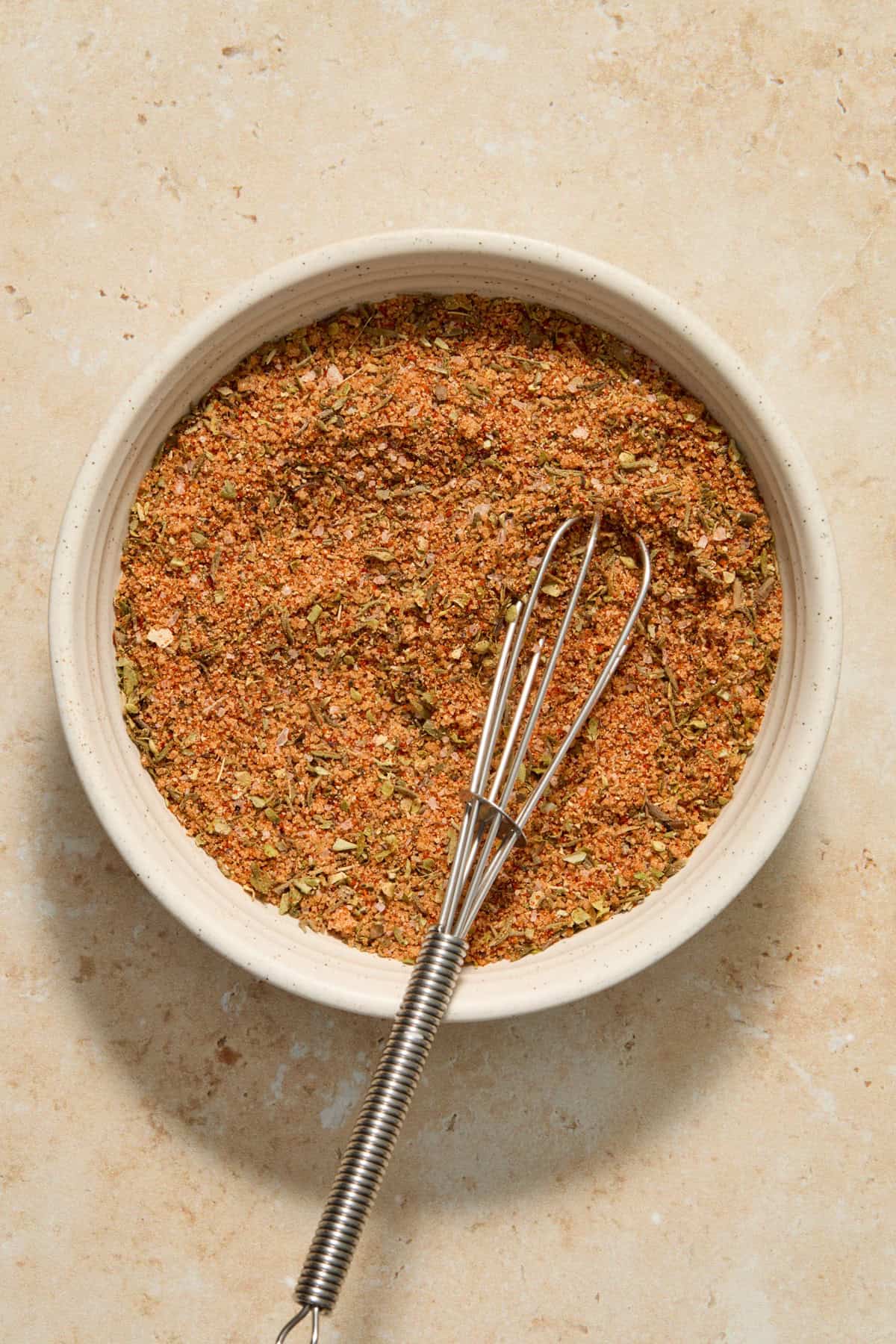 Spice rub ingredients in bowl mixed together.