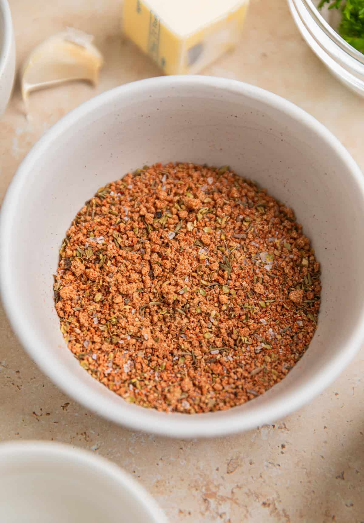 Spice rub ingredients in bowl mixed together.