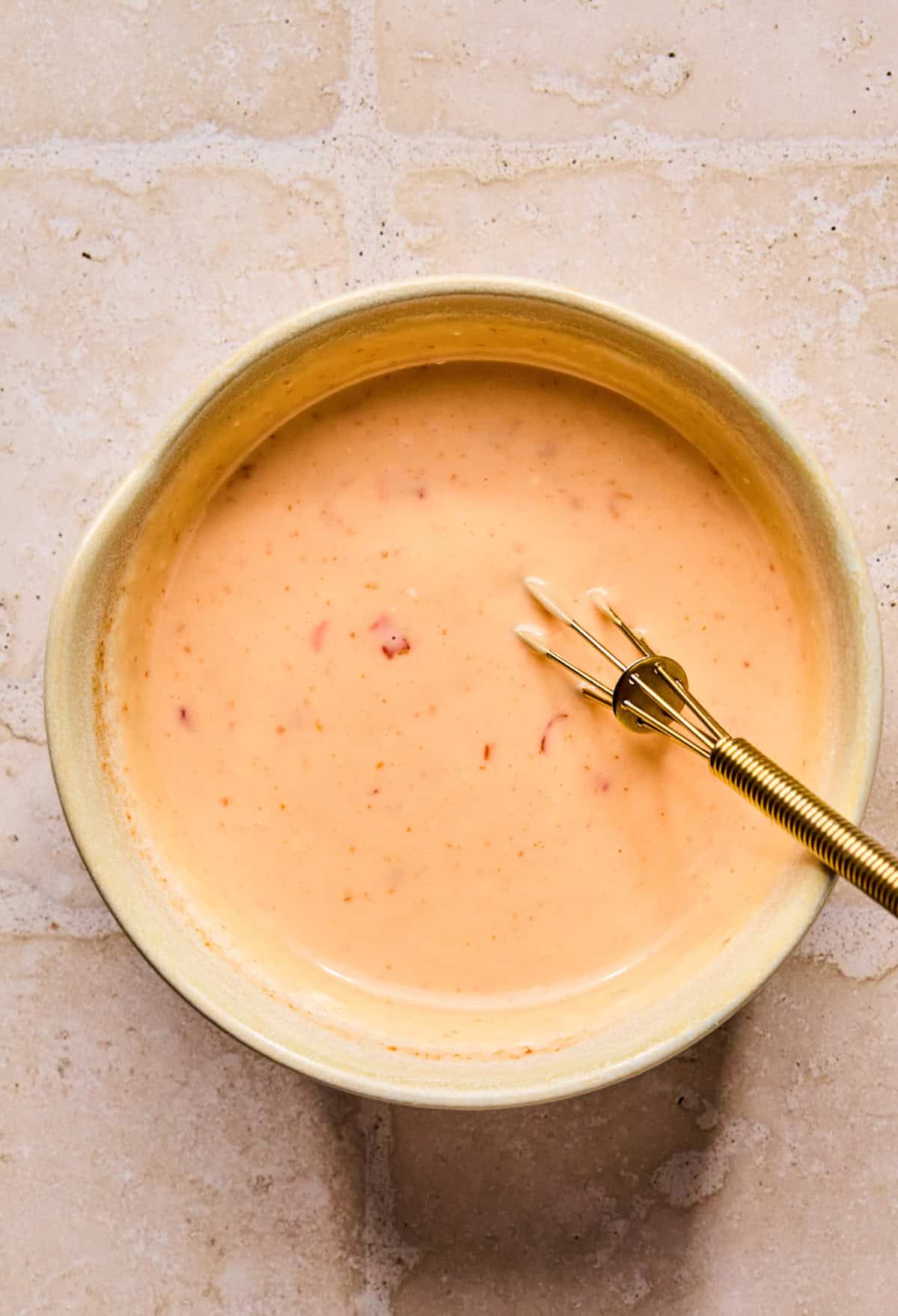 Whisk in stirred bang bang sauce in small glass dish.