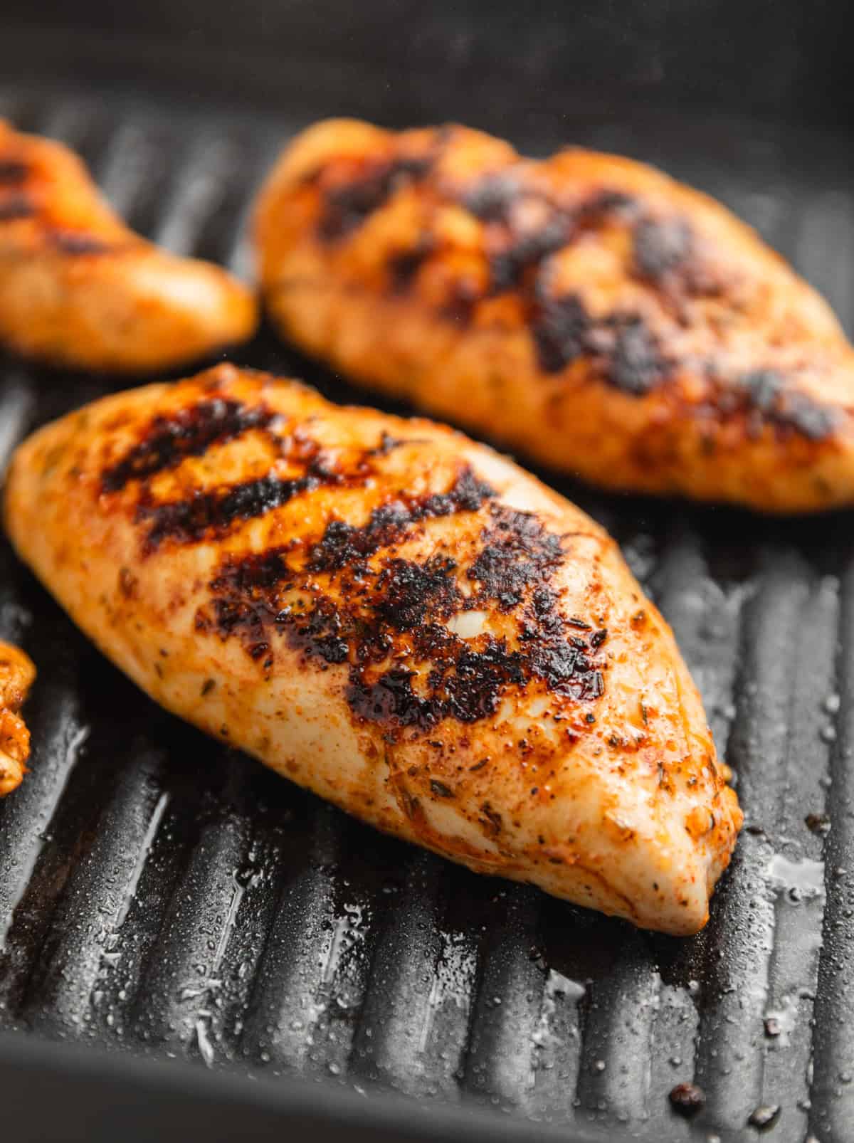 Grill pan with chicken breast.